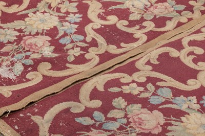 Lot 1048 - A red ground Kidderminster Axminster carpet
