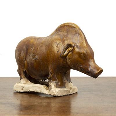 Lot 167 - Chestnut glazed figure of a boar Chinese, Tang...