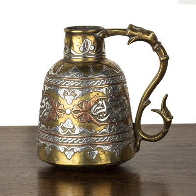 Lot 579 - Cairoware brass jug Egypt with copper and...