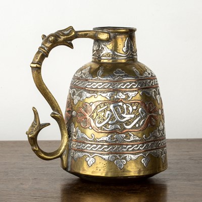 Lot 579 - Cairoware brass jug Egypt with copper and...