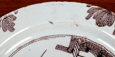 Lot 2 - An 18th century English delftware plate