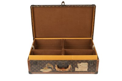 Lot 147 - A Louis Vuitton suitcase, with studded leather...