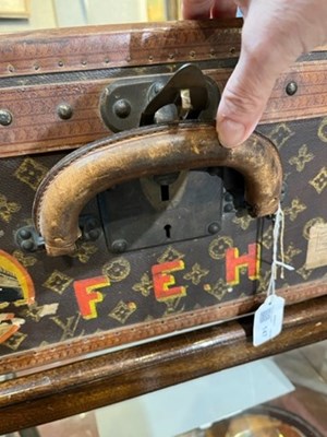 Lot 147 - A Louis Vuitton suitcase, with studded