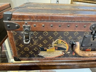 Lot 147 - A Louis Vuitton suitcase, with studded leather...