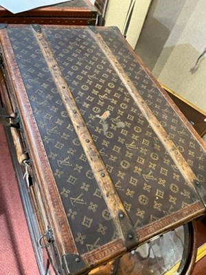 Lot 147 - A Louis Vuitton suitcase, with studded leather...