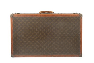 Lot 147 - A Louis Vuitton suitcase, with studded leather...