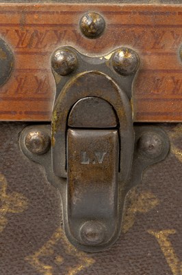 Lot 147 - A Louis Vuitton suitcase, with studded leather...