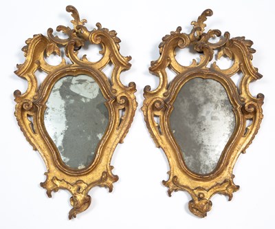 Lot 337 - A pair of 18th century Italian gilt carved wood mirrors of Rococo design