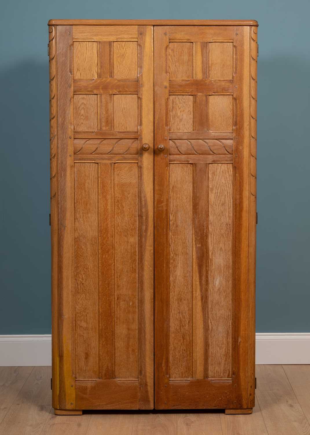 Lot 332 - An early to mid 20th century Ercol wardrobe