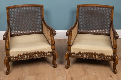 Lot 337 - A pair of Edwardian walnut bergère armchairs