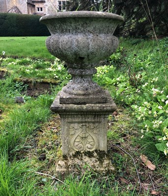 Lot 1229 - A decorative garden urn on a plinth base