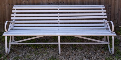 Lot 569 - A Victorian white painted garden bench with wrought iron ends