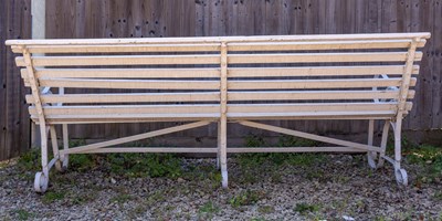Lot 569 - A Victorian white painted garden bench with wrought iron ends