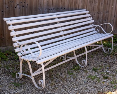 Lot 569 - A Victorian white painted garden bench with wrought iron ends