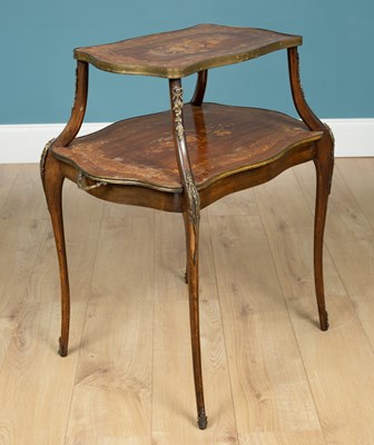 Lot 102 - A late 19th or early 20th century Continental walnut and dark stained beech étagère