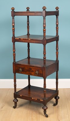 Lot 134 - An early 19th century rosewood four-tier whatnot