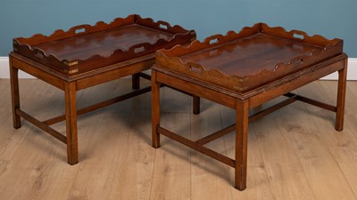Lot 137 - A pair of 20th century Campaign-style tray-top tables
