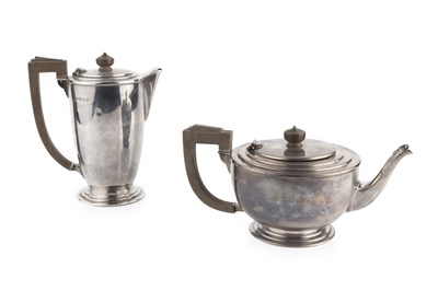 Lot 586 - A George VI silver teapot and matching hot...