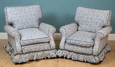 Lot 225 - A pair of blue and white floral low armchairs