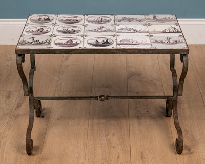 Lot 125 - An 18th century Delft tile inset, wrought iron occasional table