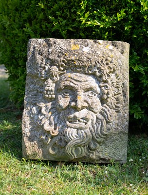 Lot 1256 - A carved stone Green Man mask panel; together with a piece of stone with a motto carved into it