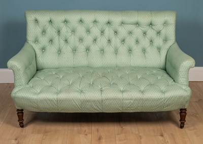 Lot 157 - A 19th century pale green button upholstered two seater deep sofa