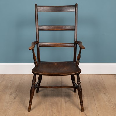 Lot 364 - An antique ash and elm high ladder back Windsor armchair