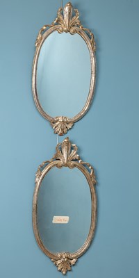 Lot 383 - A pair of oval wall mirrors