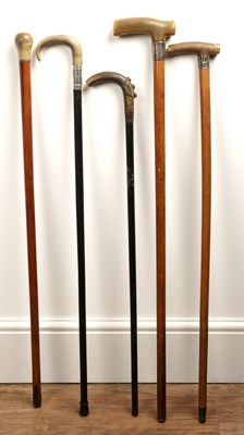 Lot 326 - Four horn (probably rhino horn) walking sticks...