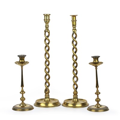 Lot 325 - A pair of 19th century brass candlesticks with...