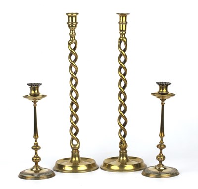 Lot 325 - A pair of 19th century brass candlesticks with...