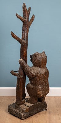 Lot 218 - An early 20th century Black Forest-style carved pine hall stand