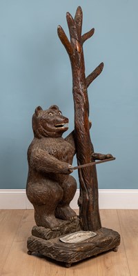 Lot 218 - An early 20th century Black Forest-style carved pine hall stand