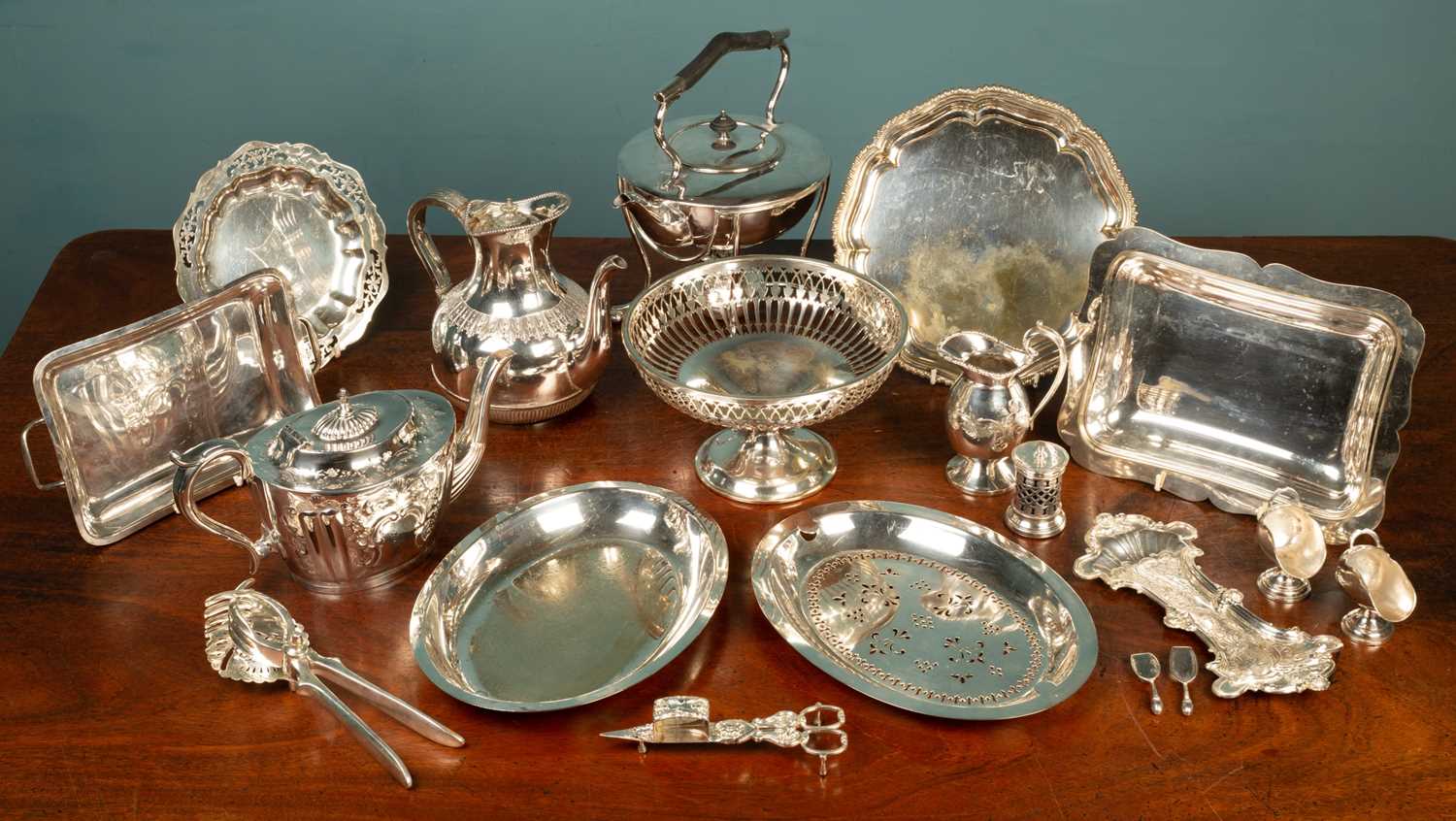 Lot 42 - A quantity of silver plated items, to include a tea kettle and stand; a pierced basket; two teapots; etc