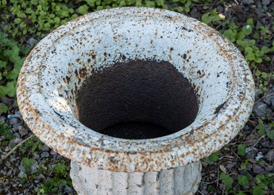 Lot 1293 - A white cast iron urn