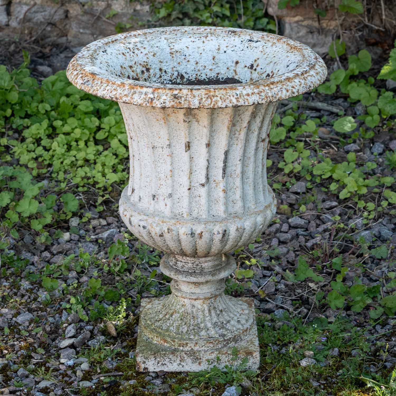 Lot 1293 - A white cast iron urn