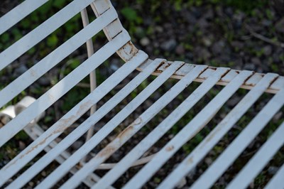 Lot 238 - A Victorian-style wrought iron garden rocking chair