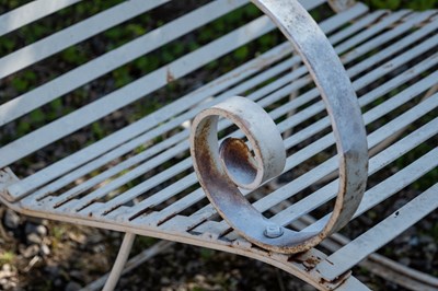 Lot 238 - A Victorian-style wrought iron garden rocking chair