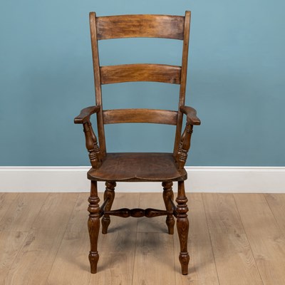 Lot 230 - A beech and elm carver chair