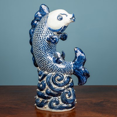 Lot 497 - A Chinese porcelain fish figure