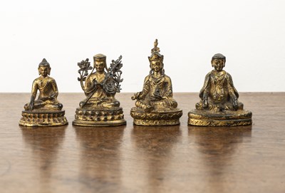 Lot 372 - Group of four small gilt bronze deity figures...