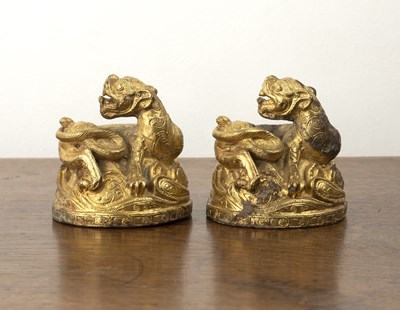 Lot 368 - Gilt bronze mat weights Chinese, Eastern Han...