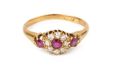 Lot 39 - A ruby and diamond cluster ring, the circular...