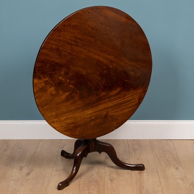 Lot 242 - A 19th century mahogany circular topped tilt table