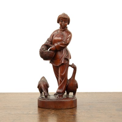 Lot 435 - Hardwood carved figure of a girl feeding geese...