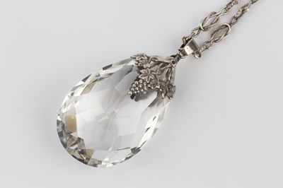 Lot 142 - An Arts and Crafts rock crystal pendant on...