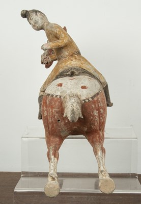 Lot 441 - Painted pottery polo player Chinese, Tang...