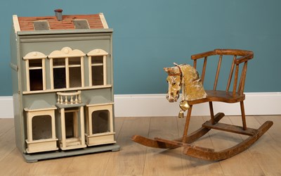 Lot 98 - An antique child's rocking horse seat and an old painted doll's house