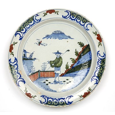 Lot 343 - An early 18th century Dutch Delft charger with...