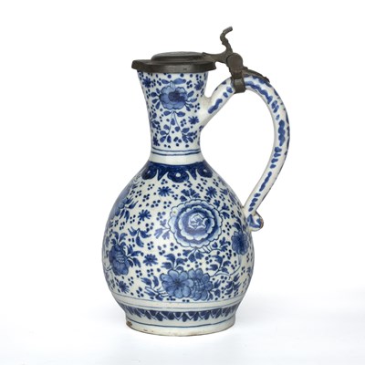 Lot 344 - A Dutch delft blue and white jug with a pewter...